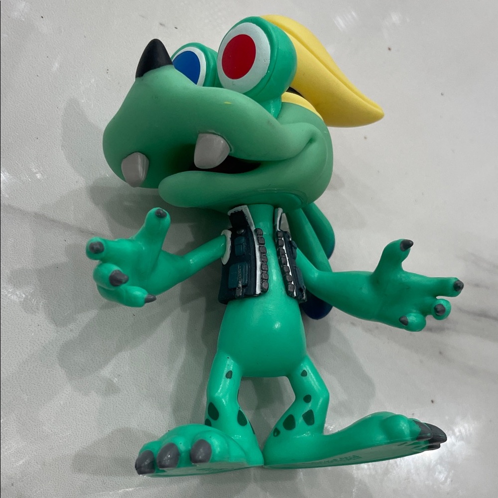 Funko Green Reptile Figure with Yellow Hair and Red-Blue Eyes